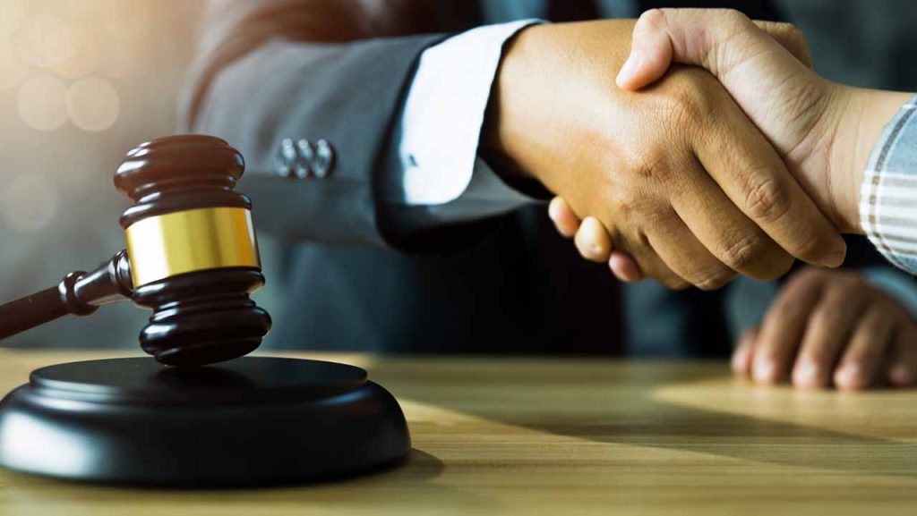 Handshake in a courtroom